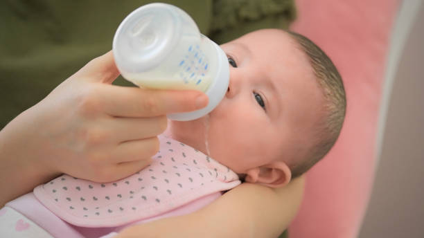 istock Breast Milk Drinking with Baby Bottle 1363748663