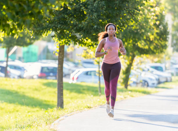 istock Woman running in public park 1363750452