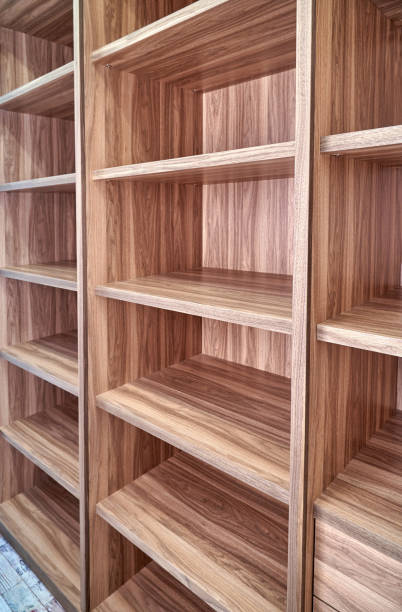 istock Cabinet of walnut solid veneer in empty walk-in closet 1363750516