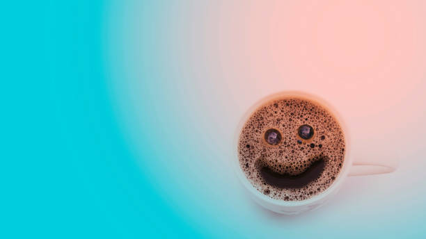istock smile face cream coffee on red and blue light background. isolate 1363750549