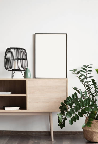 istock Artwork mock-ups in interior design. Blank white picture frames on a wall 1363750571