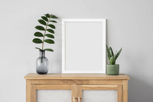 istock Artwork mock-ups in interior design. Blank white picture frames on a wall 1363750572