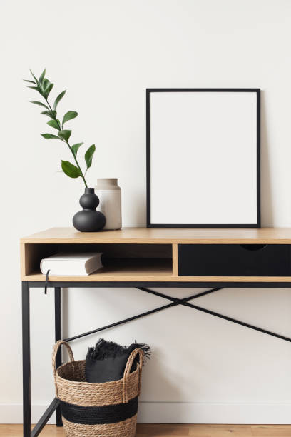 istock Artwork mock-ups in interior design. Blank white picture frames on a wall 1363750635