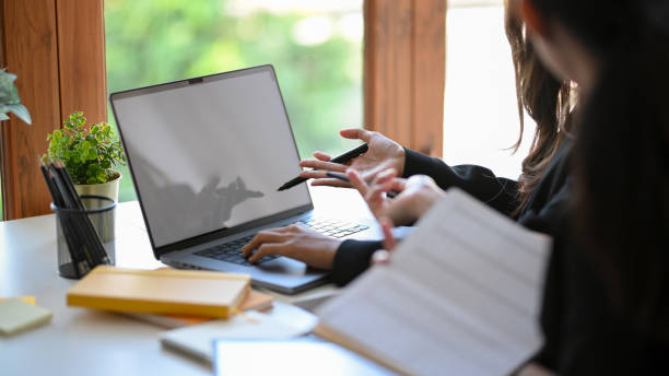 istock Two of female financial worker discussing and analysing their assignment 1363753084