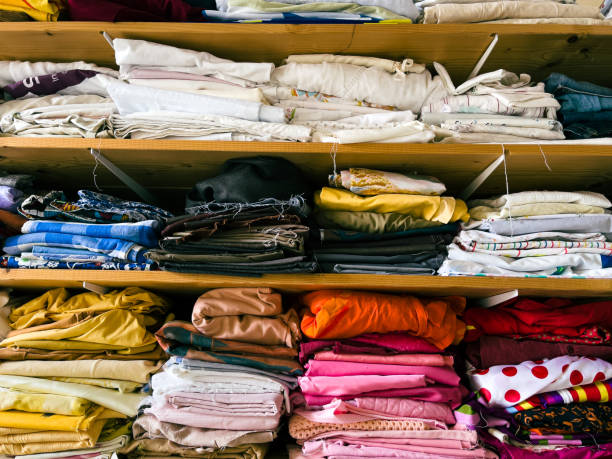 istock Scraps of fabric on the shelf of a textile workshop 1363754136