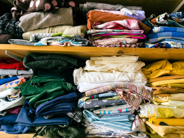 istock Scraps of fabric on the shelf of a textile workshop 1363754182