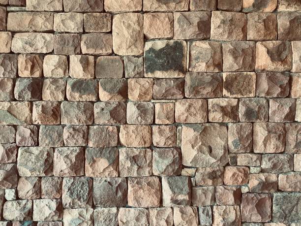 istock a stone wall with stones of different sizes 1363754565