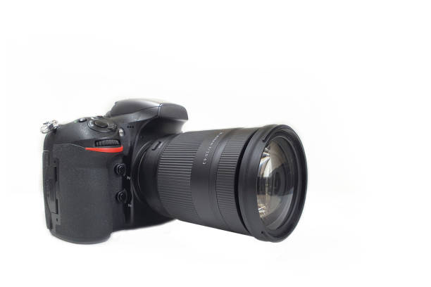 istock Digital camera with tele lens, professional isolated on white 1363755480