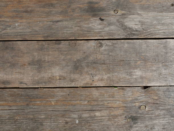 istock Old Brown wood board sheet with black and gray stain on the surface 1363756879