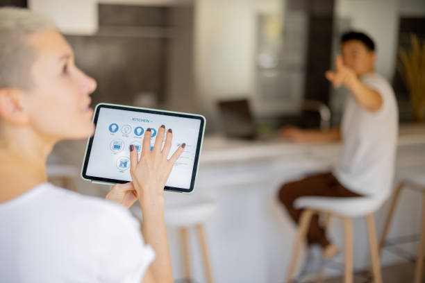 istock Woman push button on kitchen app on digital tablet 1363758292
