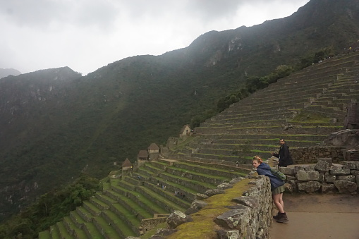 24 January 2018 tourists watching machu picchu farming walls Peru Aguas Calientes village