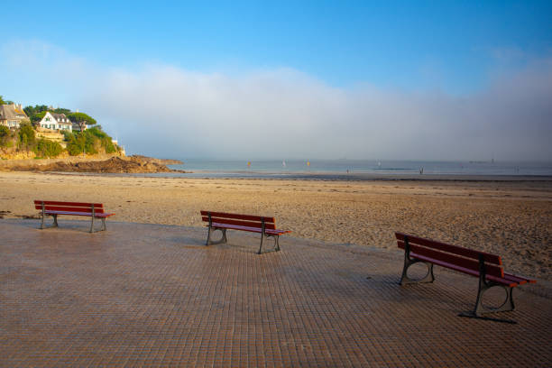 istock Three empty benches on the amazing promenade du Clair de Lune,Dinard, 1363760668