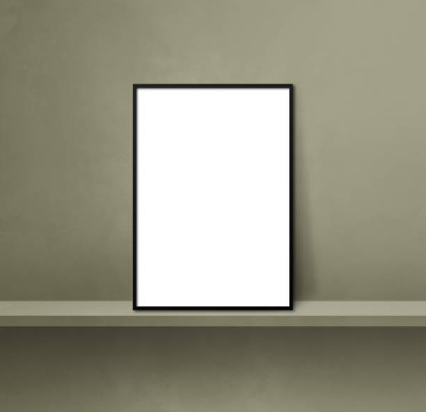 istock Black picture frame leaning on a green shelf. 3d illustration. Square background 1363761431