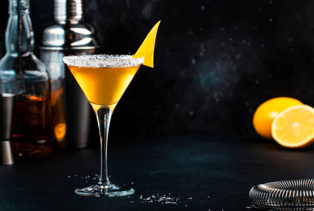 Sidecar cocktail with cognac, liqueur, lemon juice and ice. Black background, bar tools, copy space Sidecar cocktail with cognac, liqueur, lemon juice and ice. Black background, bar tools, copy space sidecar photos stock pictures, royalty-free photos & images