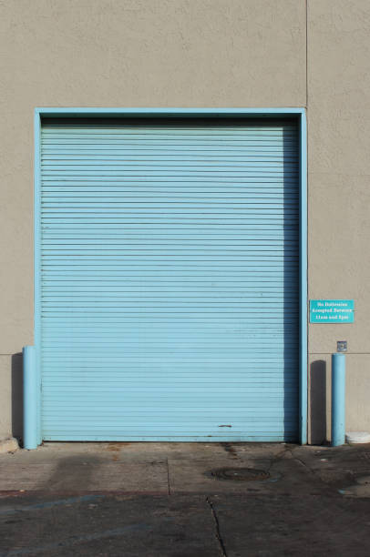 istock Garage Door on Warehouse and Regular Door 1363763020