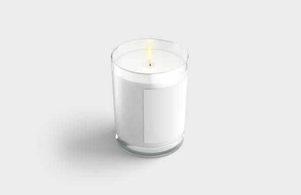 istock Blank white pillar candle in glass jar with label mockup 1363763029