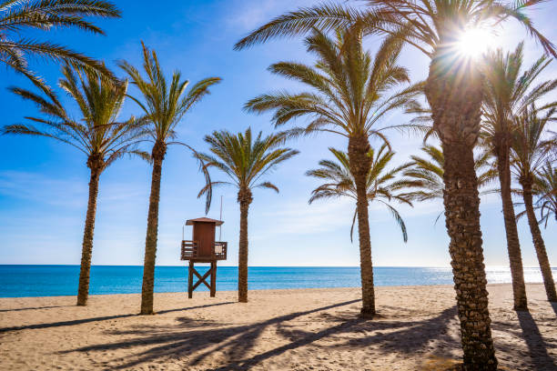 Torremolinos beach Playa de la Carihuela in Costa del Sol of Mal Torremolinos beach Playa de la Carihuela in Costa del Sol of Malaga in Andalusia Spain pretty beach house stock pictures, royalty-free photos & images