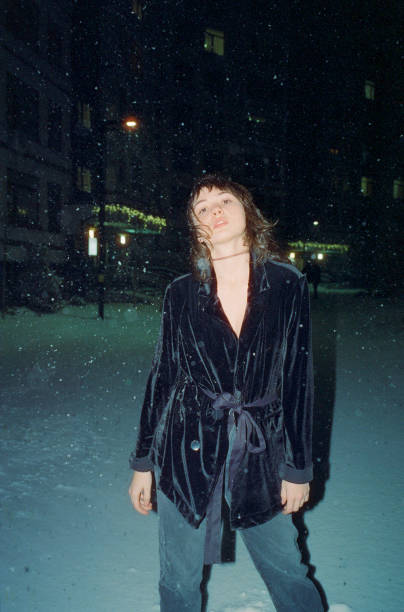 istock Woman in black blazer under the snow 1363764634