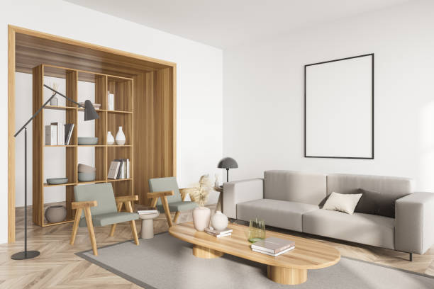istock White guest room interior with sofa and armchairs, shelf and mockup poster 1363765933