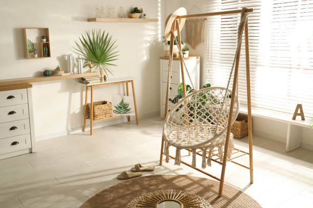 istock Comfortable hammock chair in stylish room. Interior design 1363766015