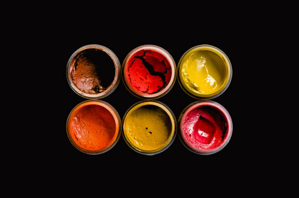 istock Dried gouache paints in red colors on black background 1363766262
