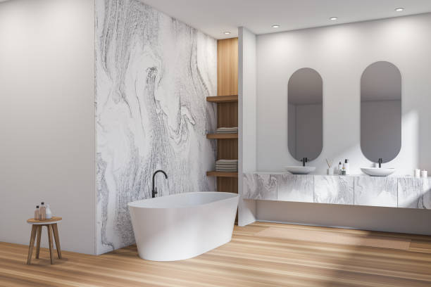istock Corner view on bright bathroom interior with two sinks, bathtub 1363766308