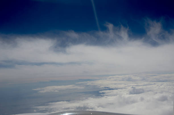 istock White cloud outside the window of plane 1363767142