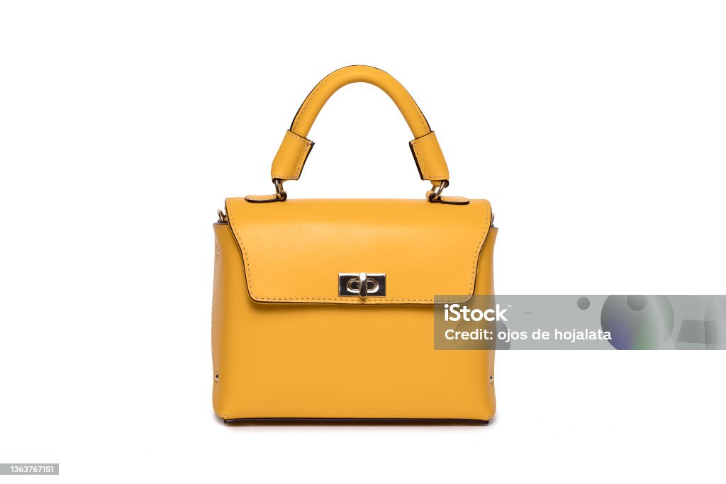 Yellow leather bag of isolated woman on white background. Purse Stock Photo