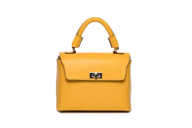Photo of Yellow leather bag of isolated woman on white background.