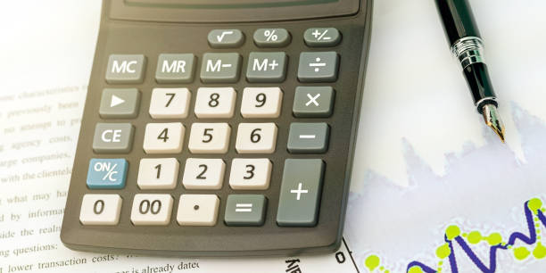 istock outdated calculator with colored keys lies on table by pen 1363767259