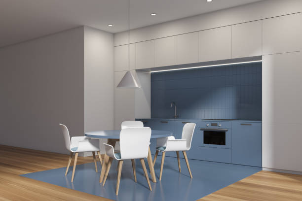 istock White and blue kitchen interior with table and chairs, wooden floor 1363767522