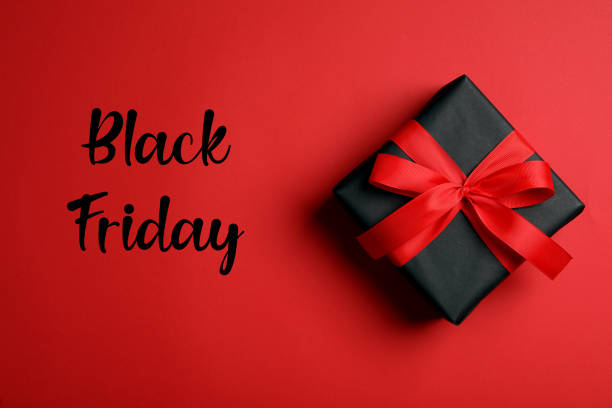 istock Phrase Black Friday and gift box on red background, top view 1363767523