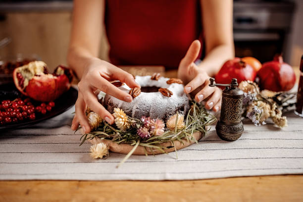 istock Putting finishing touch on a cake 1363769504