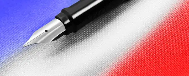 Fountain pen and flag blue white red close up