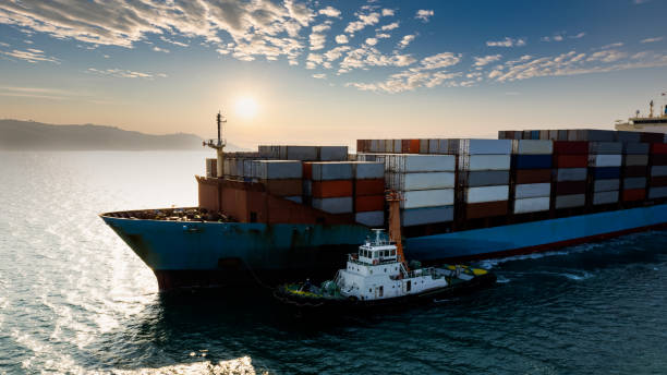 istock container cargo ship carrying commercial container in import export business commerce logistic and transportation of international by container ship at morning over the sunlight 1363774884