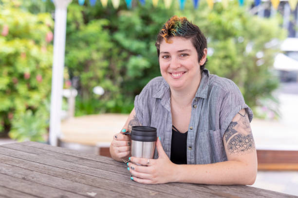 istock Happy woman with a reusable coffee cup 1363777137