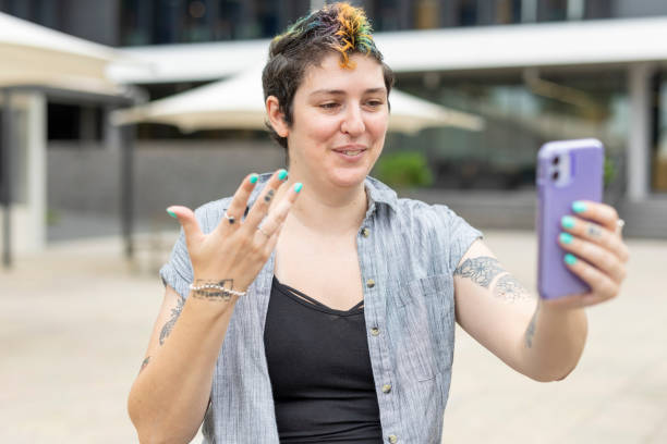 istock Happy woman making a video call on a mobile phone 1363777152
