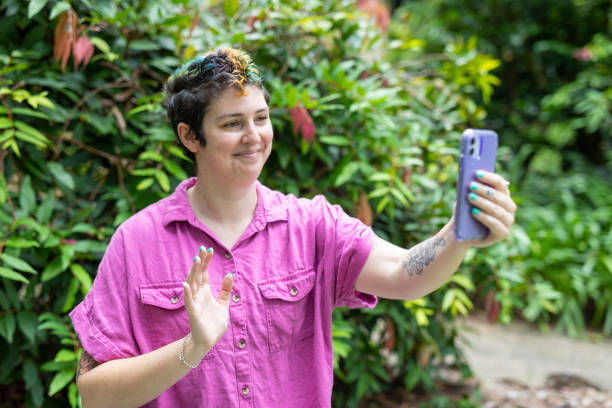 istock Happy woman making a video call on a mobile phone 1363777155