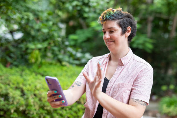 istock Happy woman making a video call on a mobile phone 1363777177