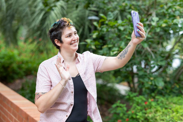 istock Happy woman making a video call on a mobile phone 1363777181