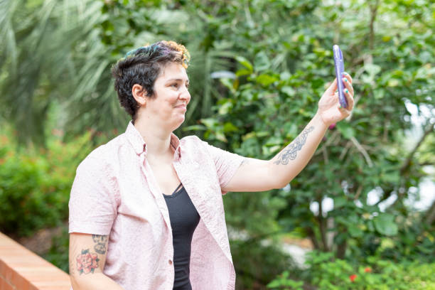 istock Happy woman making a video call on a mobile phone 1363777217