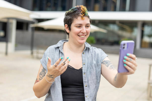 istock Happy woman making a video call on a mobile phone 1363777220