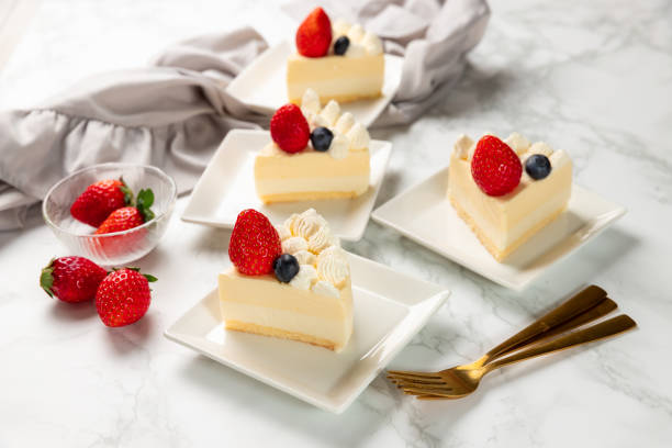 istock Delicious cheesecake with fresh strawberries and blueberries without baking on marble table 1363779028