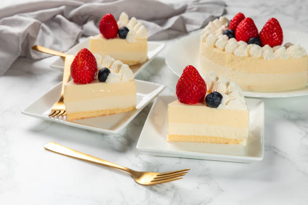 istock Delicious cheesecake with fresh strawberries and blueberries without baking on marble table 1363779093