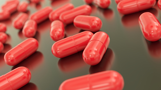Red capsules. Medicine concept