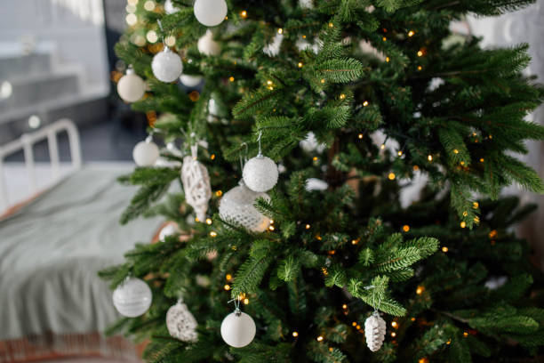 istock christmas tree with white balls in the apartment 1363779834