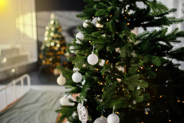 istock christmas tree with white balls in the apartment 1363779860