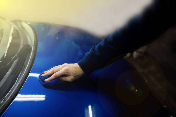 istock polishing the car body with microfiber, applying nanoceramics. 1363779941