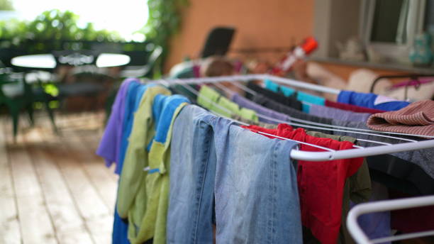 istock Drying of colourful clothes. Laundry drying racks 1363781236