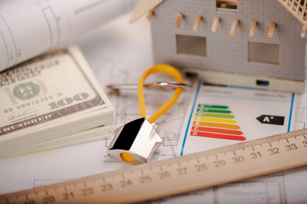 istock A model home and house key on architectural floor plans. 1363782781